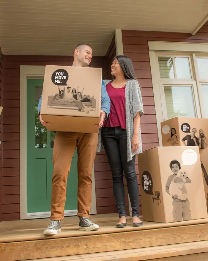 couple smiling with boxes